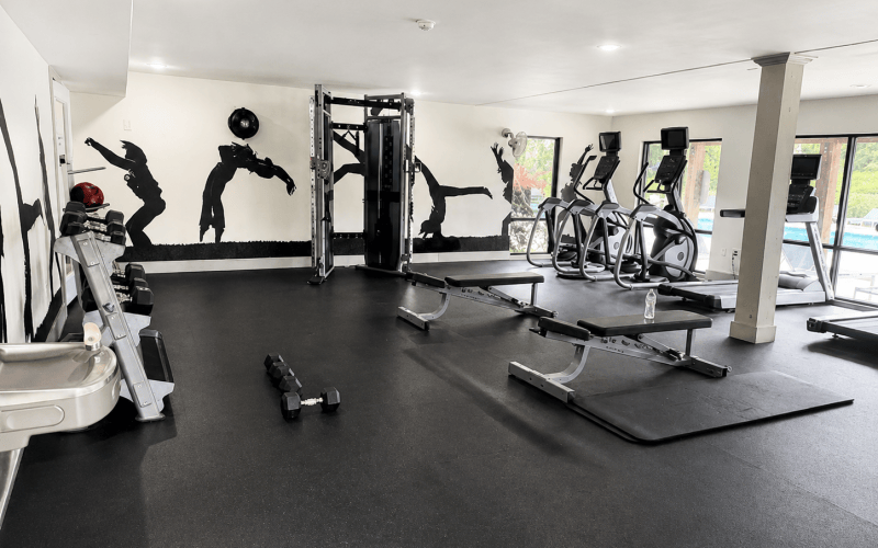 Large fitness center with multiple machines at Domain & Gateway at Cedar in Decatur, GA